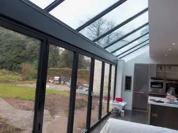 GRAND DESIGN CONSTRUCTION : Internal view of Marine Finish PP Coated 4000 series Aluminium Bi fold doors double glazed ; K2 Foiled and bespoke sprayed . self clean glass. Aluminium pressing to cover steel work Our Aluminium Bi fold range is polyester powder coated. They can come with either 28 mm argon filed double glazing or 44mm argon filed triple glazing. Our range of Aluminium Bi-fold doors are Centor C1, Schuco, allstyle, Upvc, and wood Bifolds. Our Aluminium Bifolds can be found on the Wirral in areas such a Caldy CH48, Aluminium Bifold doors can also be found in West Kirby CH48. Due to an explosion in property in Liverpool there are many more aluminium Bifold doors being installed in areas such as Formby, Crosby and Southport. Our aluminium Bi-fold doors can also be found in Alderly Edge, Aluminium Bifold doors can be found in Nutsford and Tarpoley. Our Aluminium Bifold doors can also be found in Prestbury, near Wilmslow. Example of aluminium triple glazed bi-f